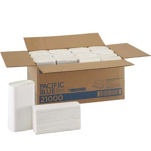 Box of Pacific Blue 21000 paper towels with a stack of towels in front on a white background