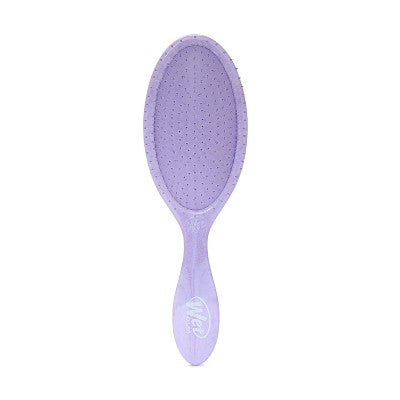 Lilac Purple detangling hairbrush with a textured handle on a white background. Lavender hair brush.