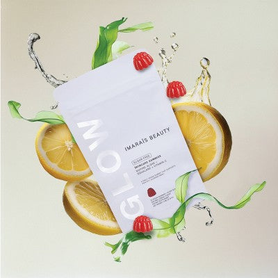 Imaraïs Beauty Glow Skincare Gummies vegan and sugar-free pouch surrounded by fresh lemon slices, raspberries, green leaves, and water splashes on a soft beige background, promoting plant-based beauty and radiant skin.
