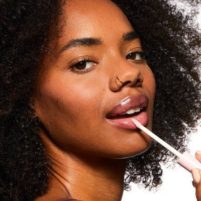Woman using a lip brush with a neutral background. Pacifica Vegan Collagen Lip Plumping Gloss 0.22 fl oz - New. FORMULATED WITHOUT:
Parabens, phthalates, or mineral oil.

PACIFICA PROMISE:
Always 100% vegan &amp; cruelty-free made with compassion for the planet, animals &amp; you.