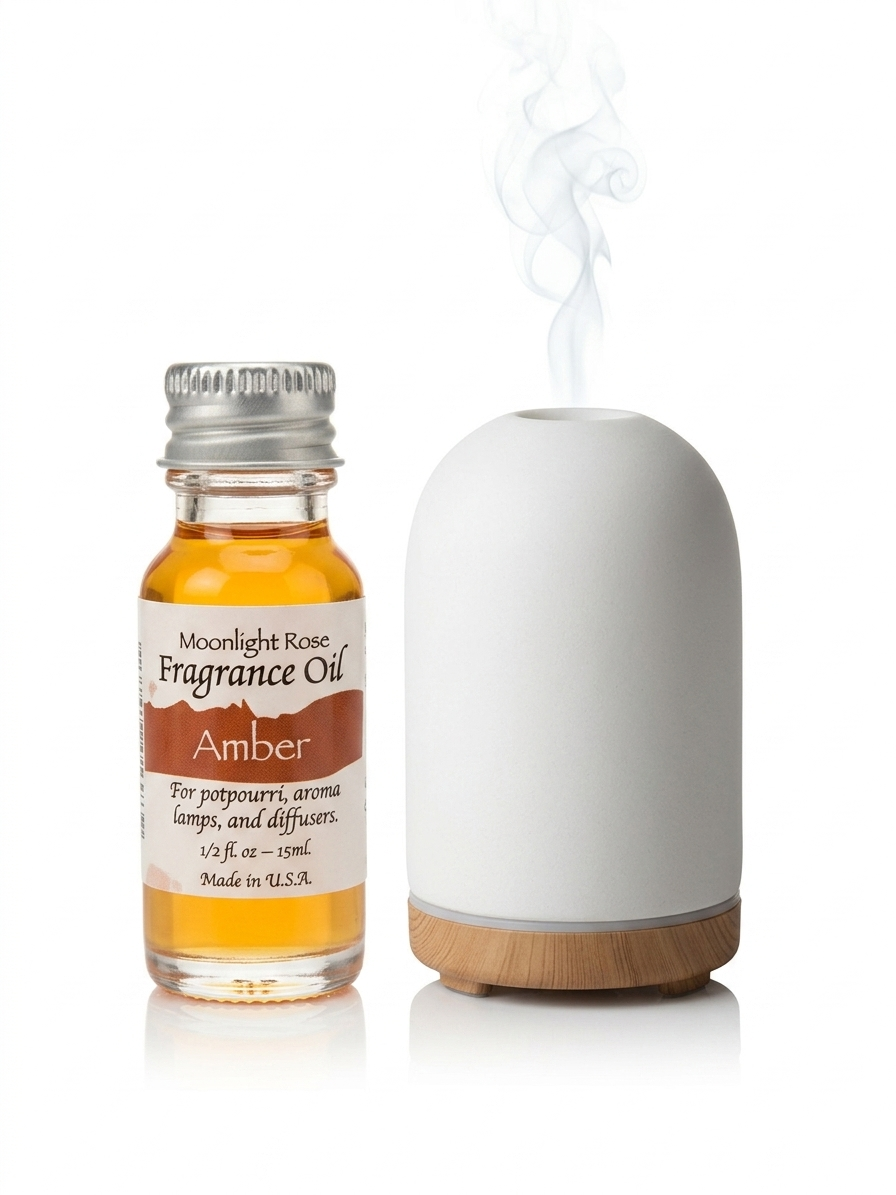 Fragrance oil bottle labeled 'Moonlight Rose' next to a white diffuser with wooden base on a white background