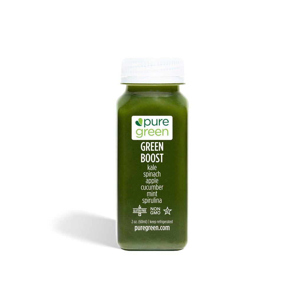 Green smoothie bottle with 'pure green' label on a white background. GREEN BOOST SHOT: Cold-Pressed NON-GMO Juice Drink with with Cucumber, Apple, Celery, Spinach, Ginger, Kale, Apple Cider, Vinegar, Spirulinal, Mint, No Added Sugar, Gluten-Free