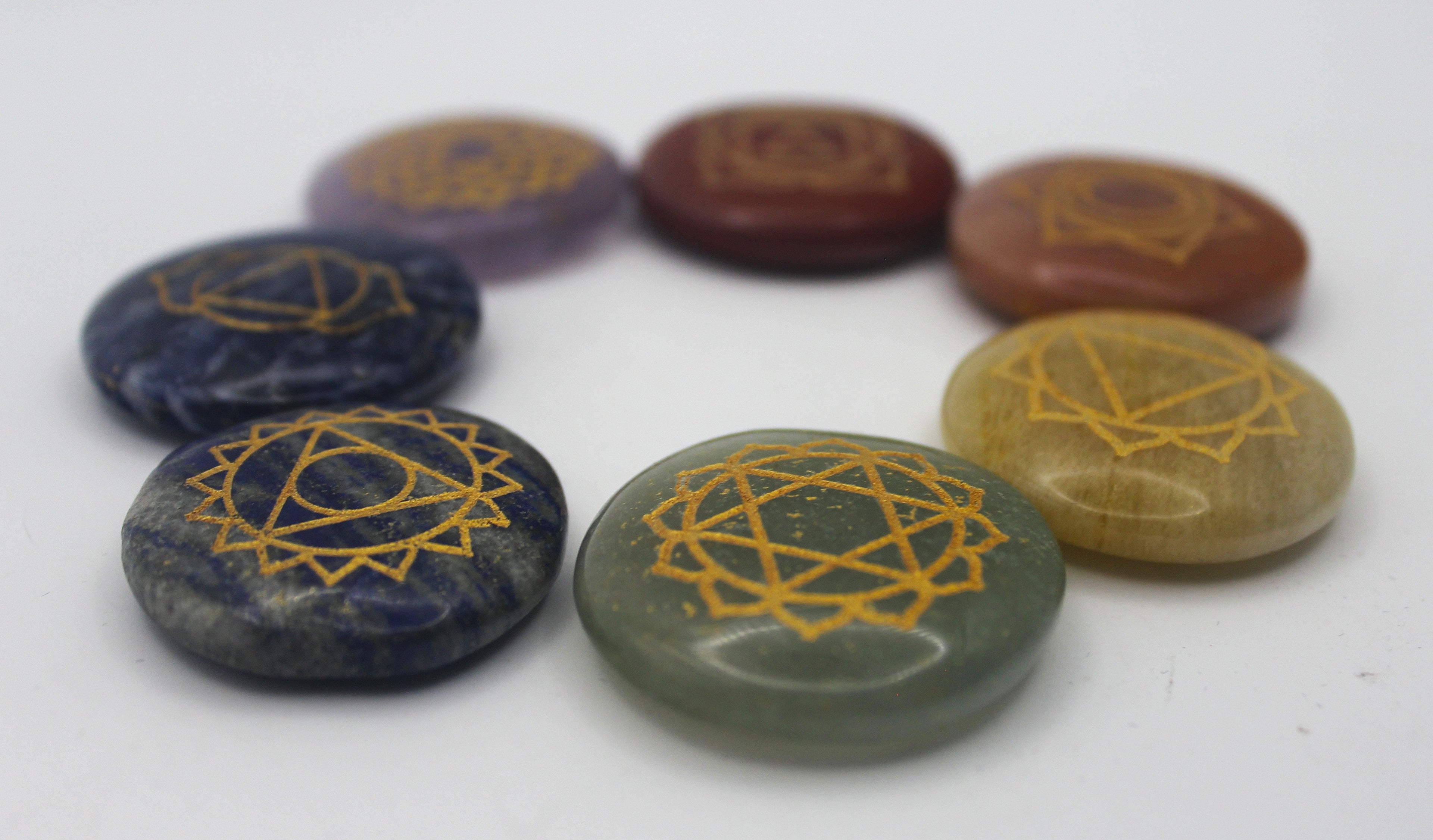 Seven Stone Chakra Set – Engraved Gold Symbols for Balance & Alignment