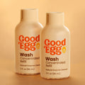 Two bottles of GoodEgg Wash Concentrated Refill natural enzyme egg cleanser on a beige background.