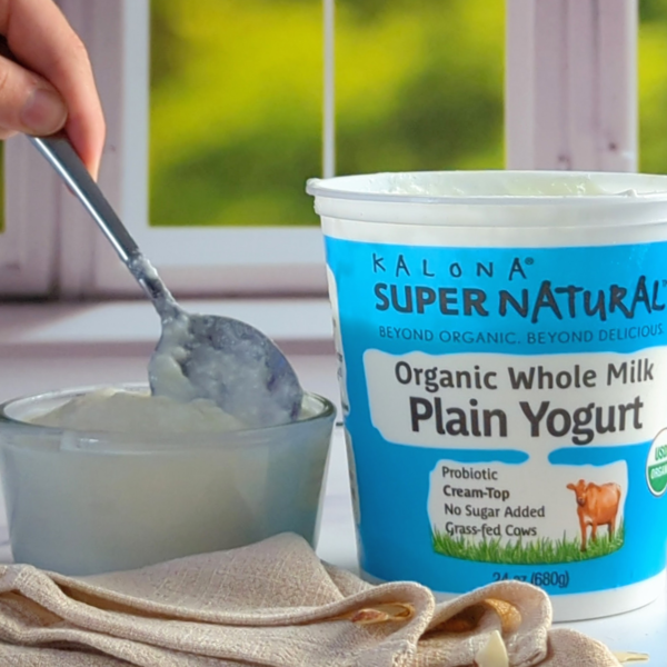 Kalona Super Natural Organic Whole Milk Plain Yogurt with a spoonful of yogurt and a container in the background. USDA Certified Organic - 24 oz (680g)