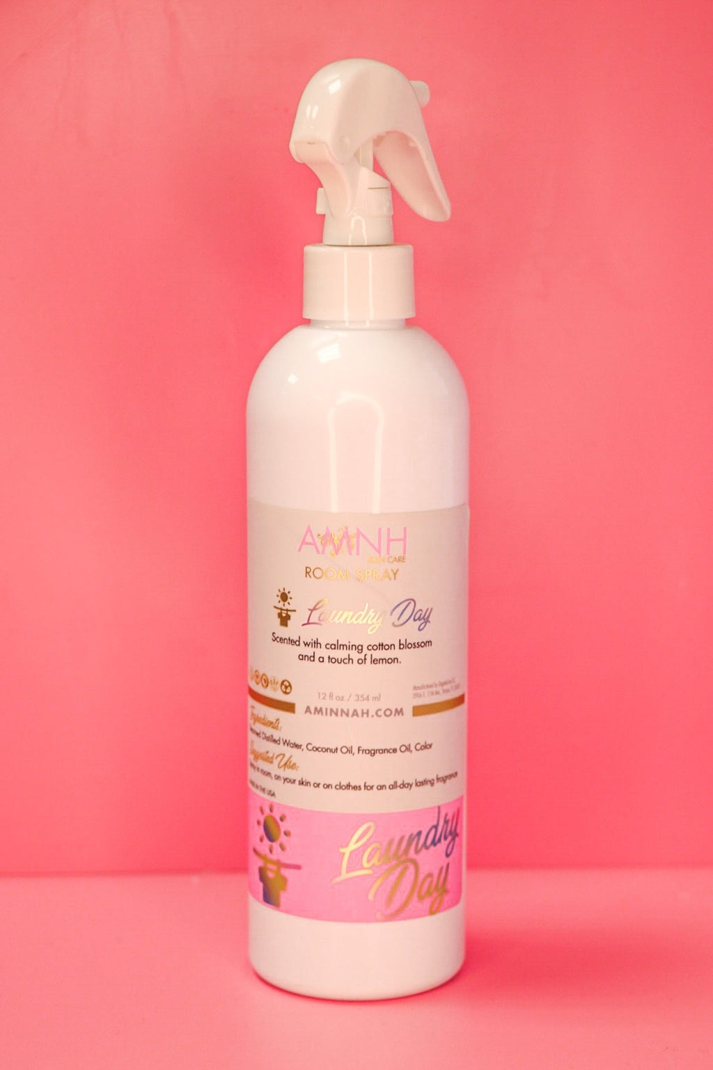 Laundry Day Room Spray by AMINNAH Clean Beauty in recyclable packaging featuring an alcohol-free room and linen spray made with natural ingredients. Clean beauty, vegan, cruelty-free, paraben-free, gluten-free, and crafted by a female-owned brand to leave your home and linens smelling fresh, clean, and inviting.