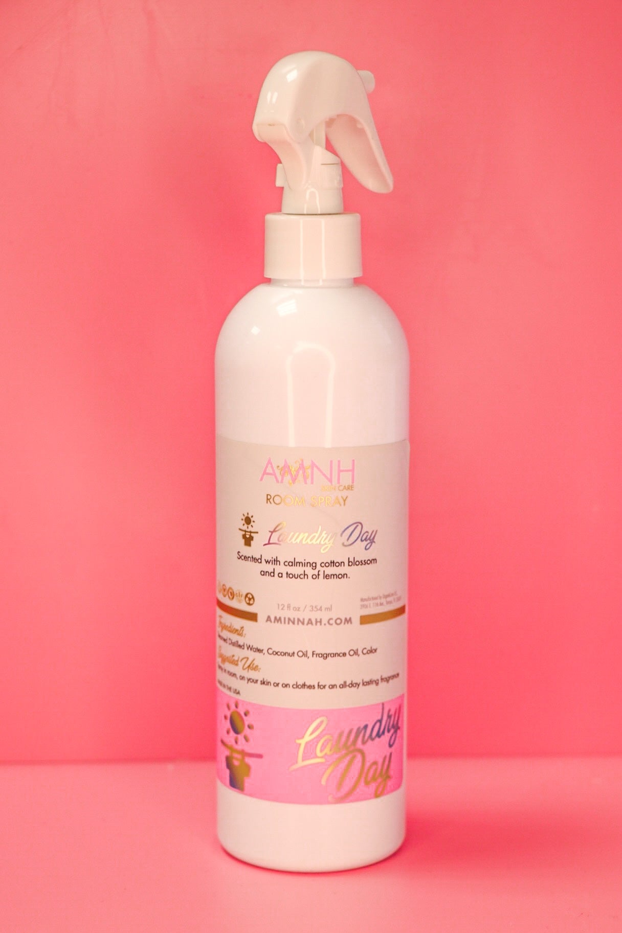 Laundry Day Room Spray by AMINNAH Clean Beauty in recyclable packaging featuring an alcohol-free room and linen spray made with natural ingredients. Clean beauty, vegan, cruelty-free, paraben-free, gluten-free, and crafted by a female-owned brand to leave your home and linens smelling fresh, clean, and inviting.