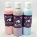 Three bottles of Tulip Tree Soap Company hand and body lotion in pink, purple, and blue on a white background. Unique blend of sunflower oil, avocado oil, and vitamin E with just a touch of cocoa butter. A light, quick-absorbing lotion that hydrates, nourishes, and soothes dry skin without leaving you feeling greasy! Plus, paraben-free, phthalate-free, good for sensitive skin.