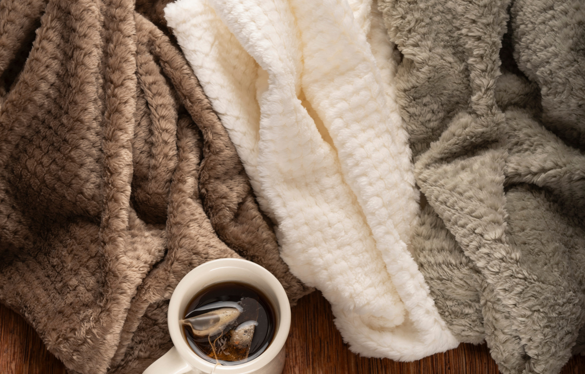 Men's Chemo Care Package with cozy textured blankets in brown, white, and gray, cup of coffee, thoughtful cancer care gift, chemotherapy comfort box, wellness gift for men, supportive treatment essentials, uplifting patient gift, Tree of Life Grocers