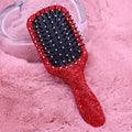 Red rhinestone pave paddle hair brush with sparkling crystal handle, black bristles and white tips, glamorous detangling styling brush for women and girls