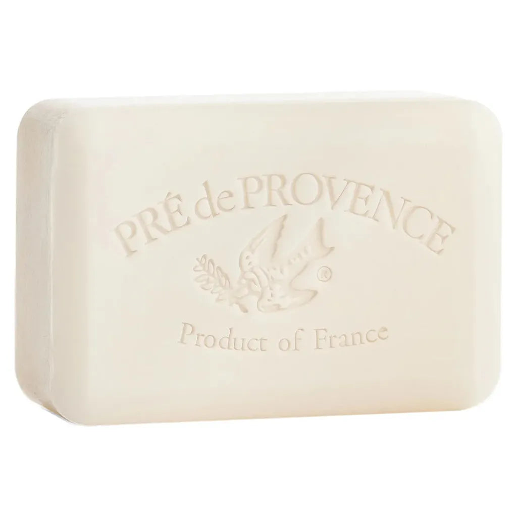 High-quality, studio-lit product photograph of a travel-size Pre de Provence Milk shea butter soap bar, featuring clear branding visible on the surface, set against a pristine, seamless white background.