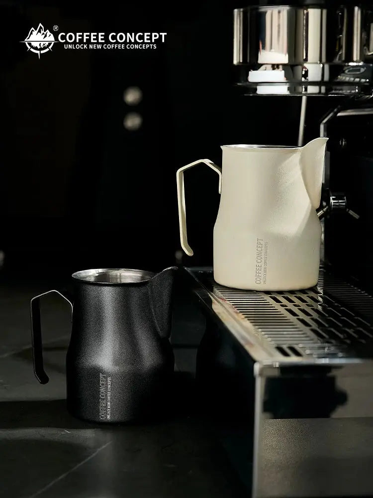 COFFEECONCEPT stainless steel bell shape milk frothing pitchers in black and sand beige, professional 350ml and 500ml latte art steaming jugs for espresso, cappuccino and barista coffee making.