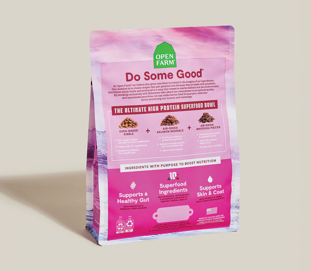 Salmon oven baked kibble air dried salmon morsels air dried whitefish pieces.pet food package with 'Open Farm' branding on a beige background
