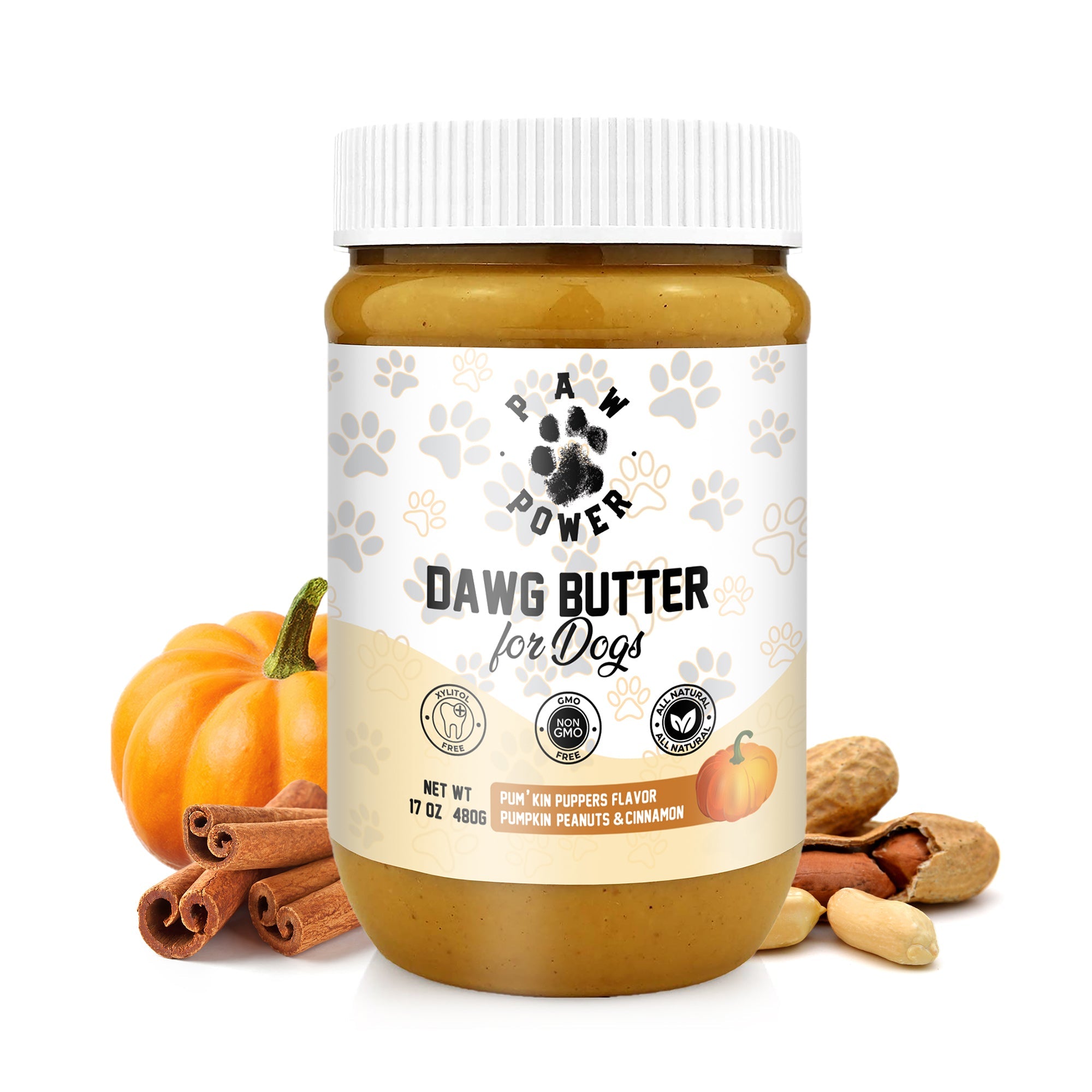 Jar of Dawg Butter for Dogs with pumpkins, cinnamon, and peanuts on a white background