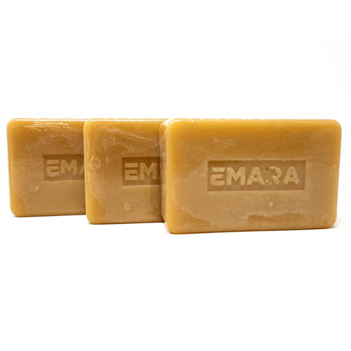 Three bars of Emara Patchouli Natural Organic Soap with warm golden-brown tones and embossed EMARA logo, 3-pack handmade botanical body soap on white background.