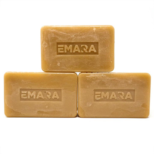 Three bars of Emara Patchouli Natural Organic Soap stacked on a white background, featuring warm golden-brown botanical soap bars with embossed EMARA logo; handmade patchouli body soap 3-pack for natural skincare, cleansing, bathing and gift sets.