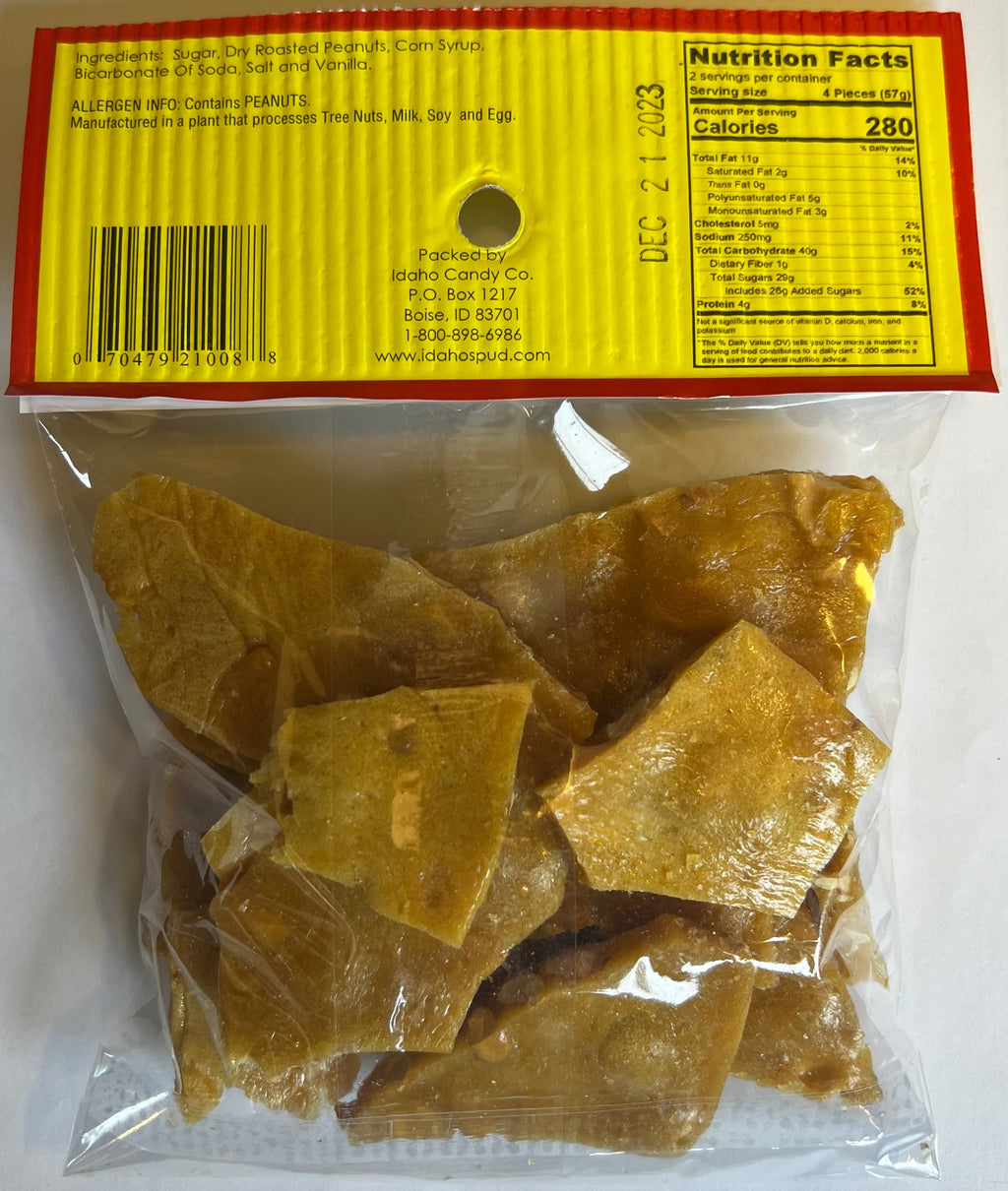 Idaho Spud Old Fashioned Peanut Brittle 4 oz bag back with roasted peanut candy, ingredients, nutrition facts, allergen info and UPC barcode