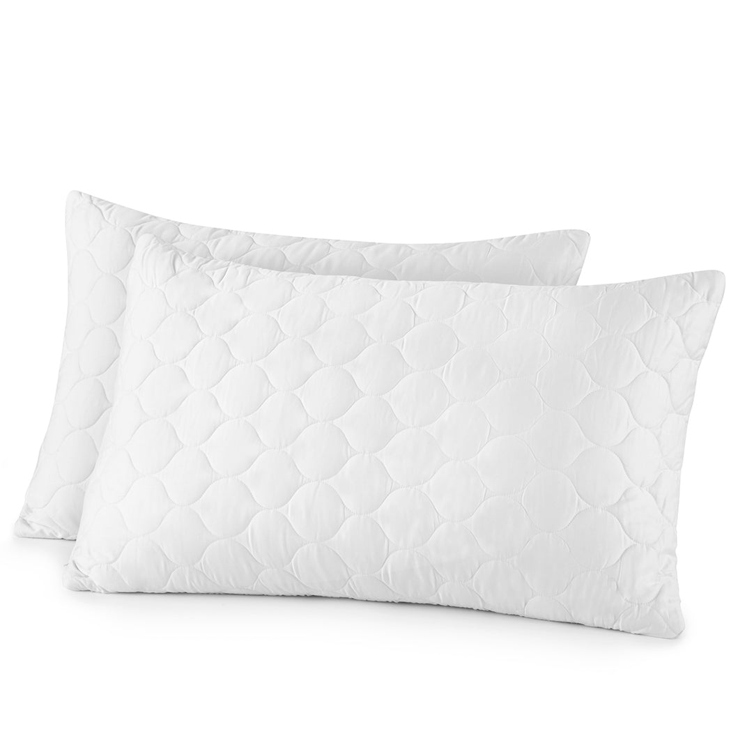 Two white quilted pillows on a white background. Organic Cotton Quilted Pillow Protectors
