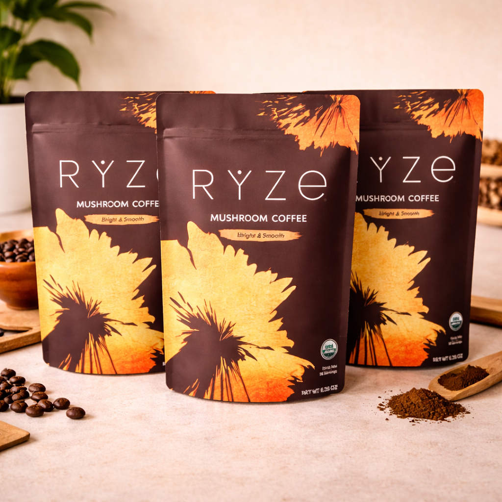 Three RYZE Superfoods Mushroom Coffee resealable stand-up pouches featuring organic Arabica coffee, six adaptogenic mushrooms, and MCT oil for clean energy, focus, and wellness.