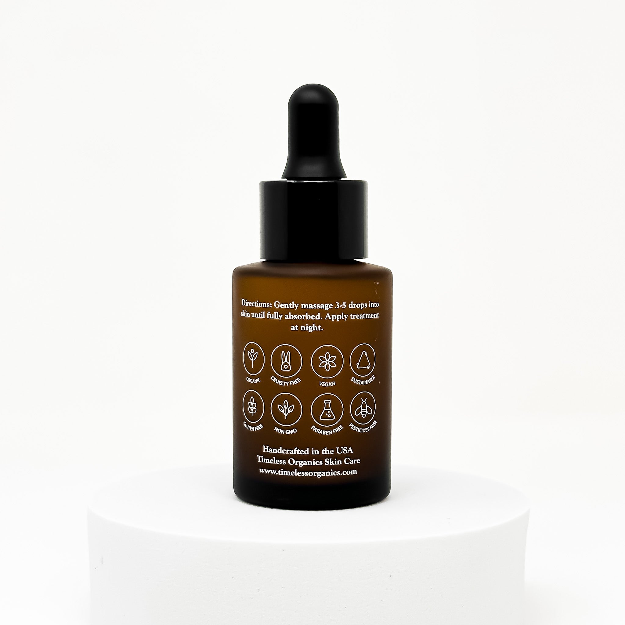 Brown bottle with black dropper on a white background