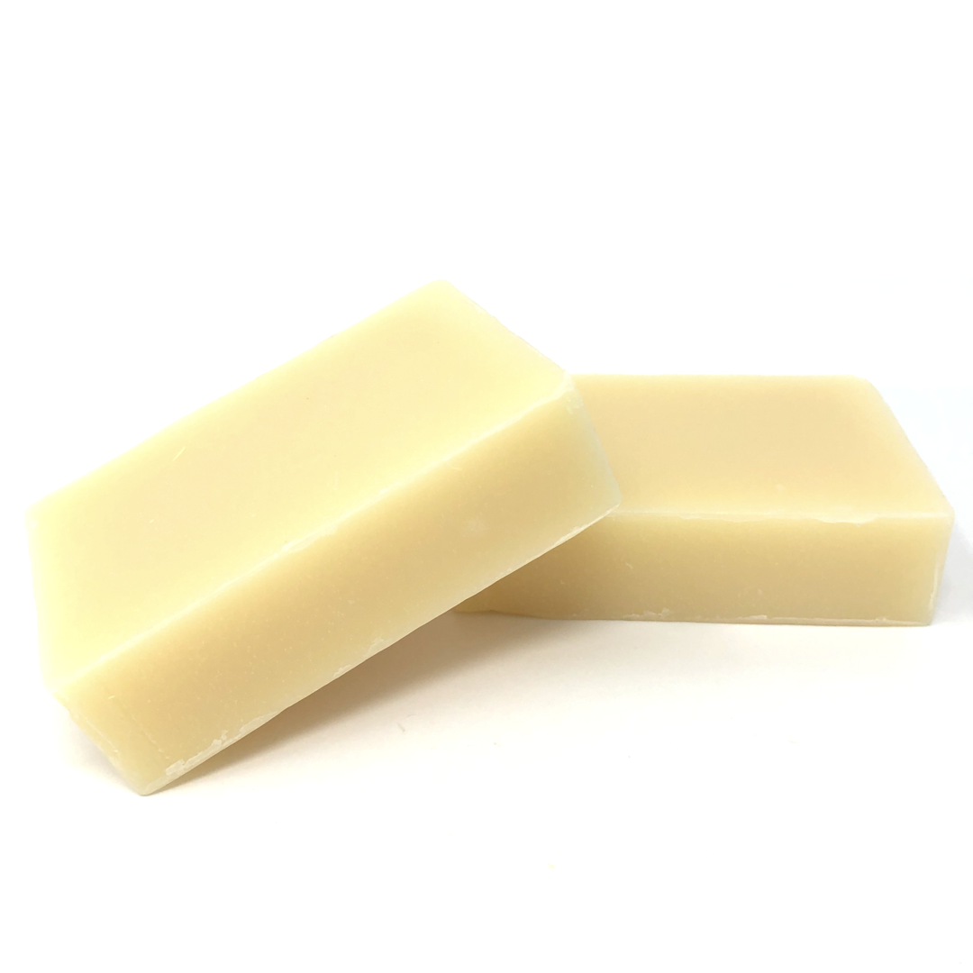 Two yellow soap bars on a white background
