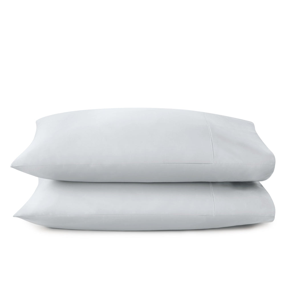 Two beige pillows stacked on a white background. 100% GOTS-Certified &amp; Fairtrade-Certified Organic Cotton
Ethically made in India
Truly soft 300-thread-count sateen weave
Envelope enclosure
Non-toxic, hypoallergenic, naturally breathable and cooling
Easy Care, Machine Wash and Tumble Dry