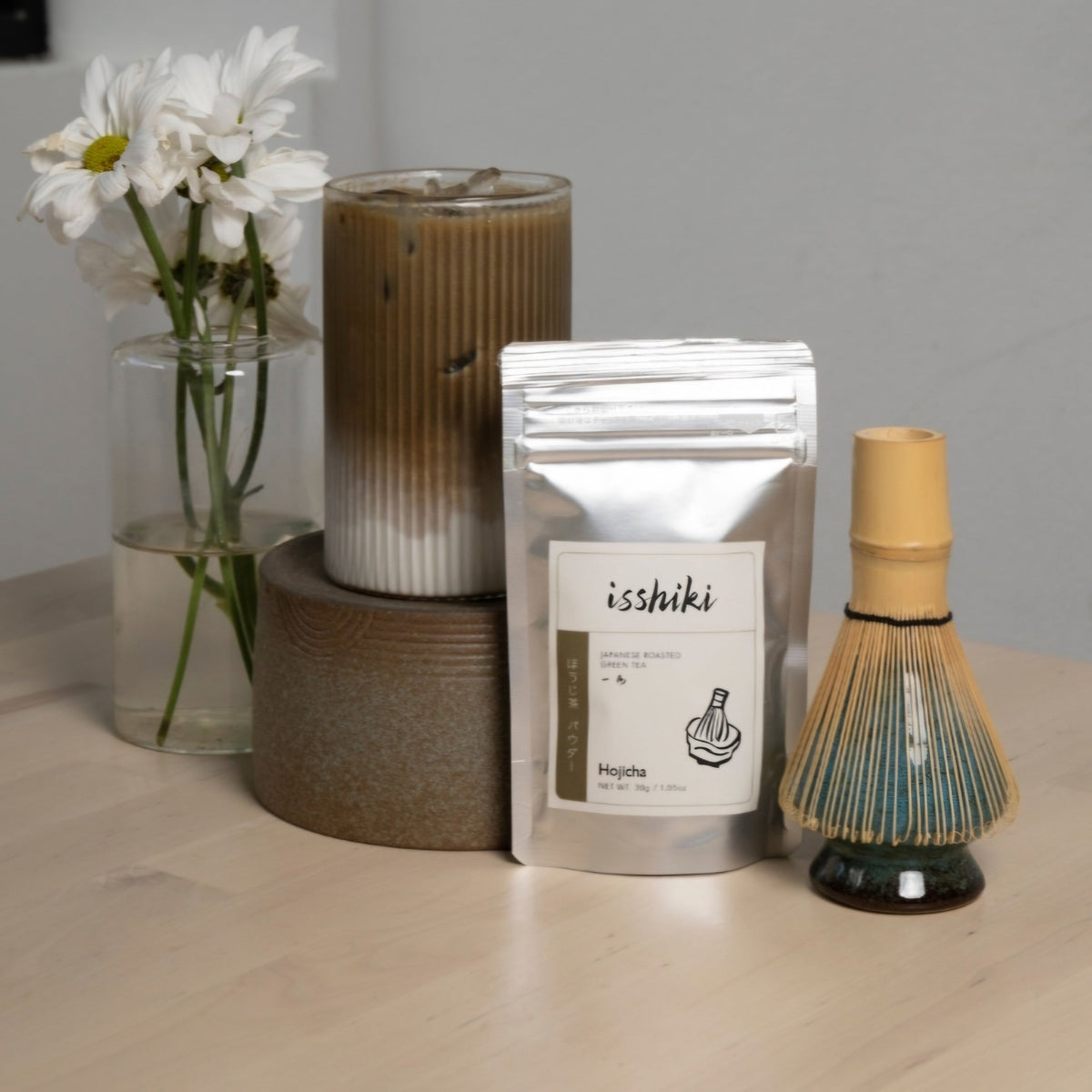 High-quality product photography of a 30g bag of Hojicha Roasted Green Tea Powder, featuring a clean, minimalist label and visible branding for Tree of Life Grocers against a professional, well-lit background.