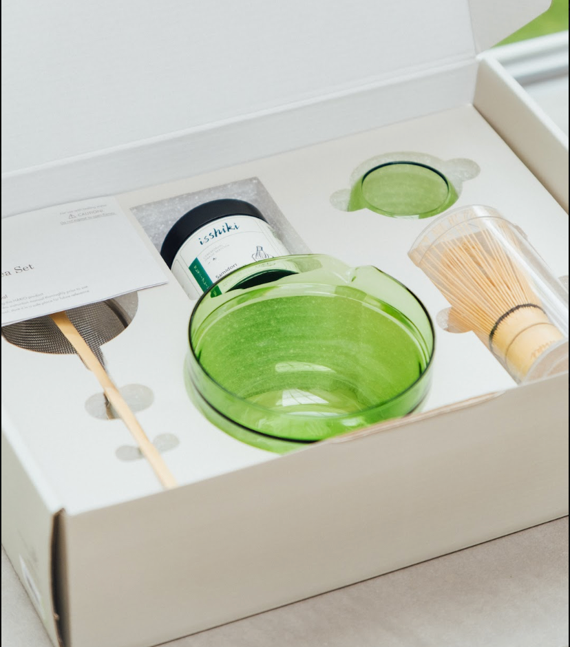 Green glass set with matchbox and matches in a box