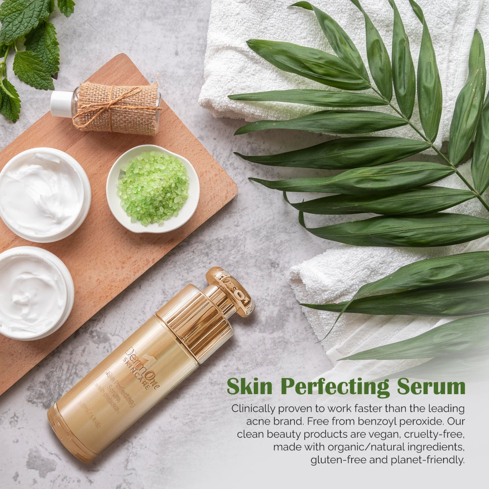 Skin Perfecting Serum promotional image featuring a gold pump bottle beside skincare cream, green bath salts, fresh botanical leaves, and spa towels, highlighting a vegan facial serum for rosacea-prone, acne-prone, and sensitive skin.