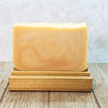 Bar of soap on a wooden stand with a light background. Fresh oranges with a background of soft vanilla and ripe raspberries&nbsp;make up the scent of this lovely orange blossom soap.
