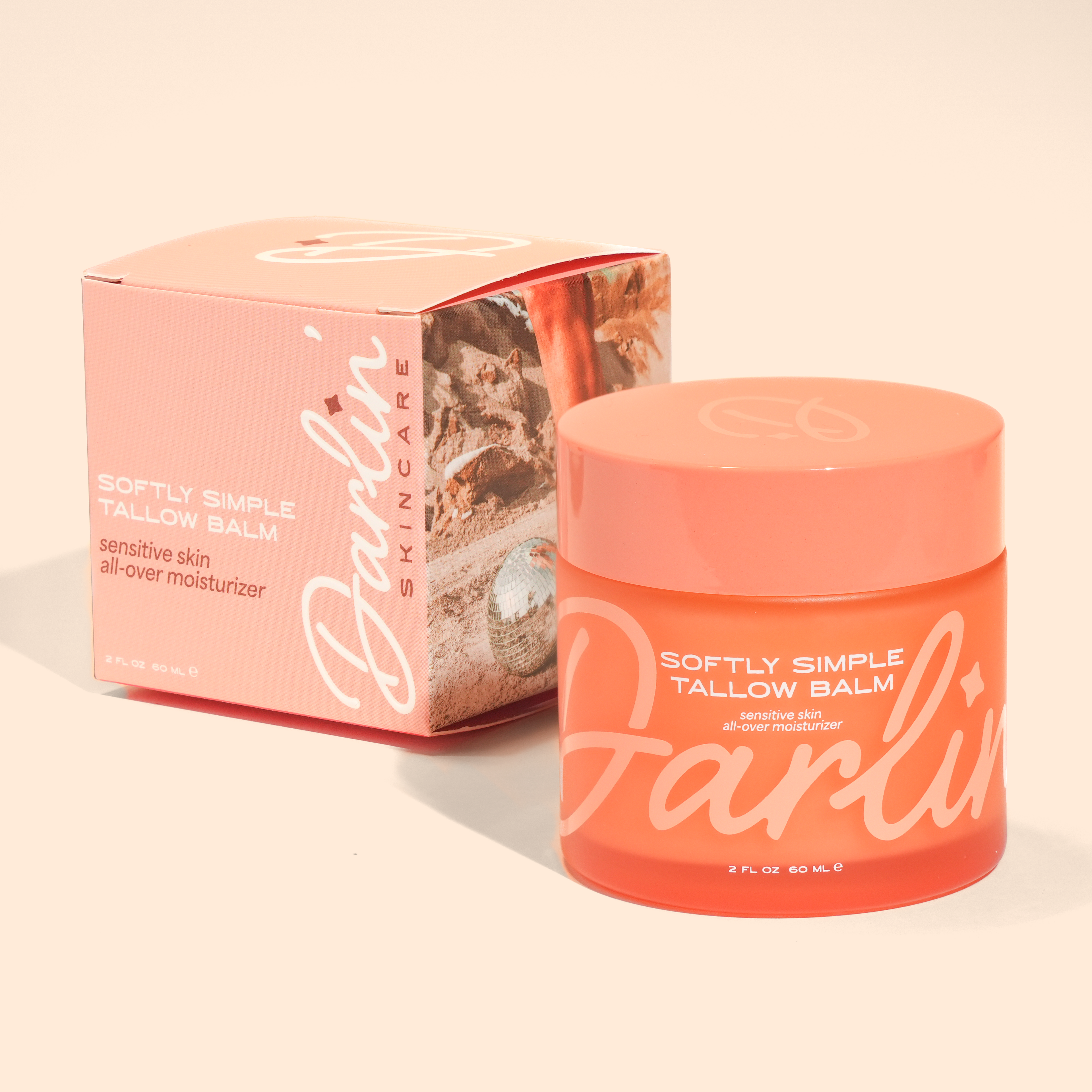 Softly Simple Tallow Balm 2 oz in frosted glass jar with matching product box, fragrance-free grass-fed beef tallow moisturizer for sensitive skin, dry skin, eczema-prone skin, face and body balm, natural all-over moisturizer, clean skincare, nourishing hydration, minimalist organic-inspired beauty product on beige background
