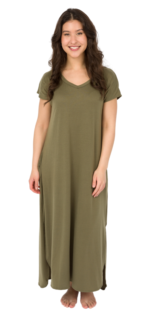 Woman wearing an olive green short-sleeve maternity maxi dress with side pockets, standing barefoot on a white background.