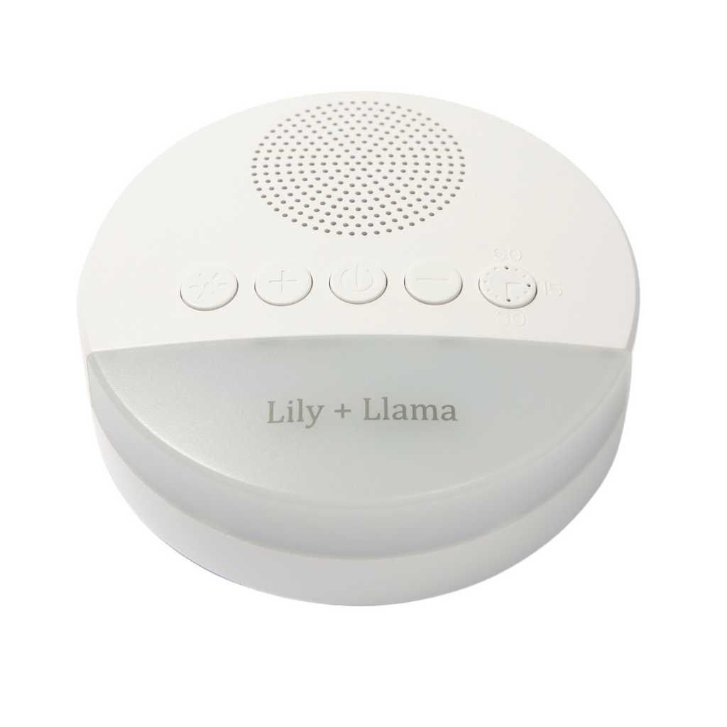 Portable white noise machine with intuitive control buttons and Lily + Llama branding, designed to provide soothing sleep sounds for babies, children, and adults.