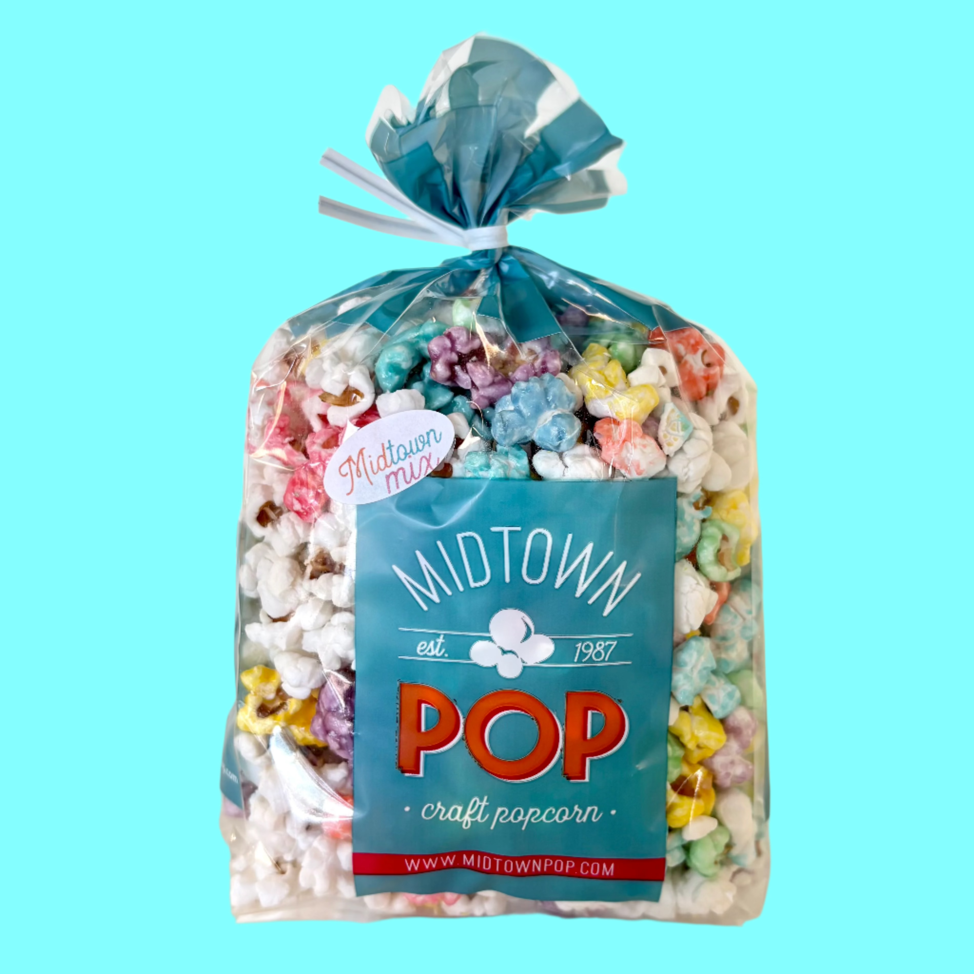 Bag of Midtown Pop craft popcorn with a blue label on a light blue background