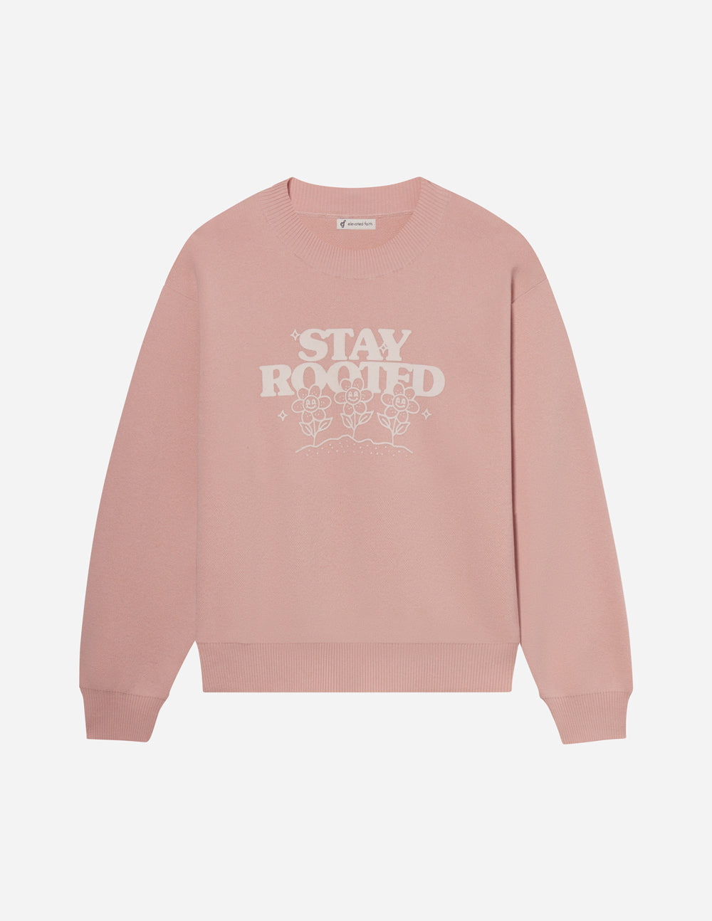 Pink sweatshirt with 'Stay Rooted' text on a white background