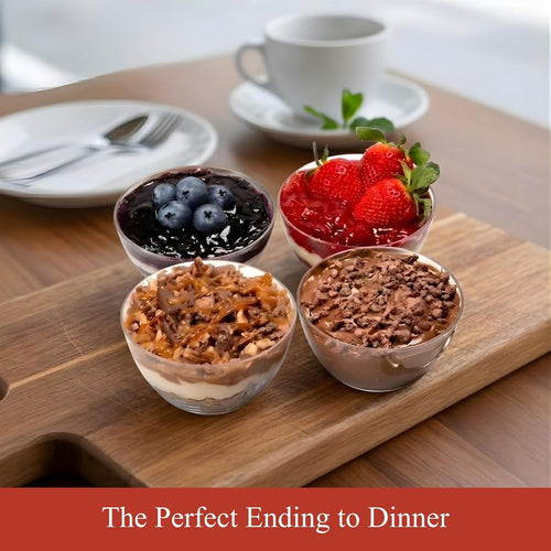 Dessert plates with various desserts on a wooden board, including berries and chocolate mousse.