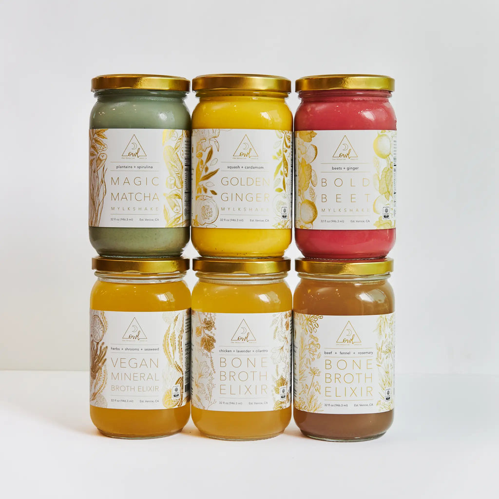 Six jars of different types of bone broth on a white background. The OWL Reset - Organic Cleanse Program with 6 Broth Elixirs, 6 Mylkshake Packets (2 Magic Matcha, 2 Golden Ginger, and 2 Bold Beet)