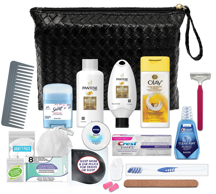 Black woven travel toiletry kit with shampoo, conditioner, body wash, facial wipes, deodorant, razor, toothbrush, toothpaste, dental floss, comb, nail file, earplugs, tissues, and personal care essentials arranged on a white background.