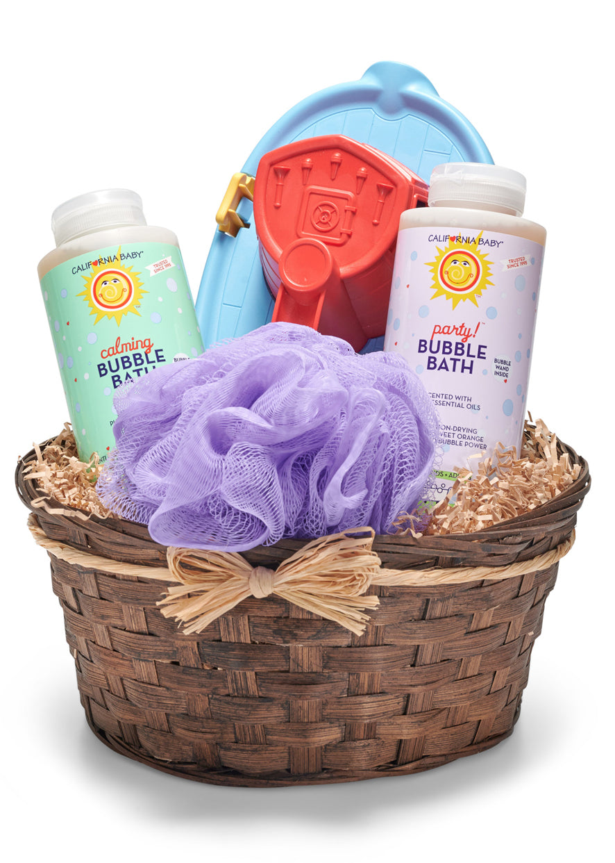 Bath time gift basket with bubble bath, loofah, and toys on a white background. Both bubble baths are crafted with plant-based, biodegradable cleansing ingredients that create rich, long-lasting bubbles without harsh sulfates or synthetic fragrances. The Calming Bubble Bath features a relaxing blend designed to help children unwind before bedtime, while the Party