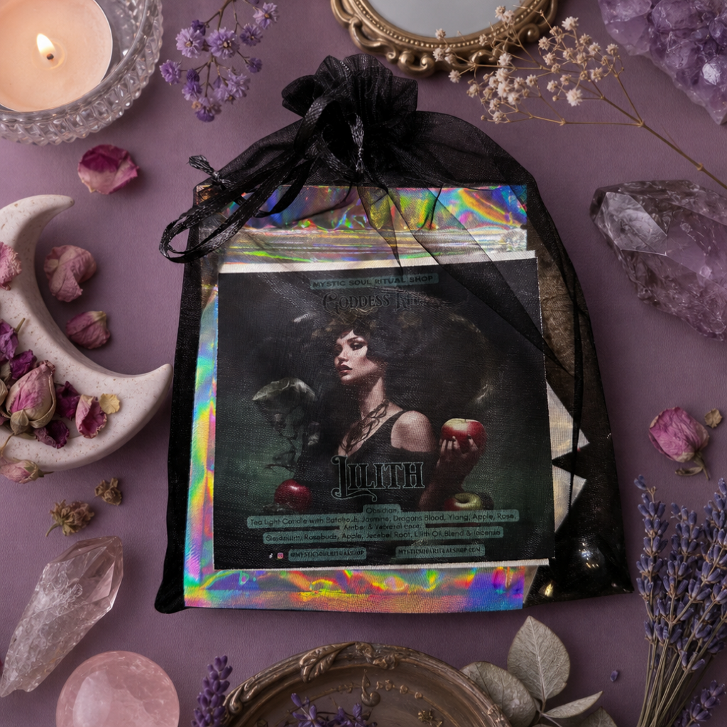 A black sheer drawstring pouch containing a tarot deck with an iridescent holographic border and a central card featuring a dark gothic portrait, styled on a purple surface with crystals, dried flowers, a candle, and decorative props.  A part pf Lilith Devotional Goddess Kit with orris root, rosebuds, incense sticks and oil for evoking Lilith: Goddess of independence, sexuality, feminine sovereignty, and righteous rage. Dark feminine occult work.