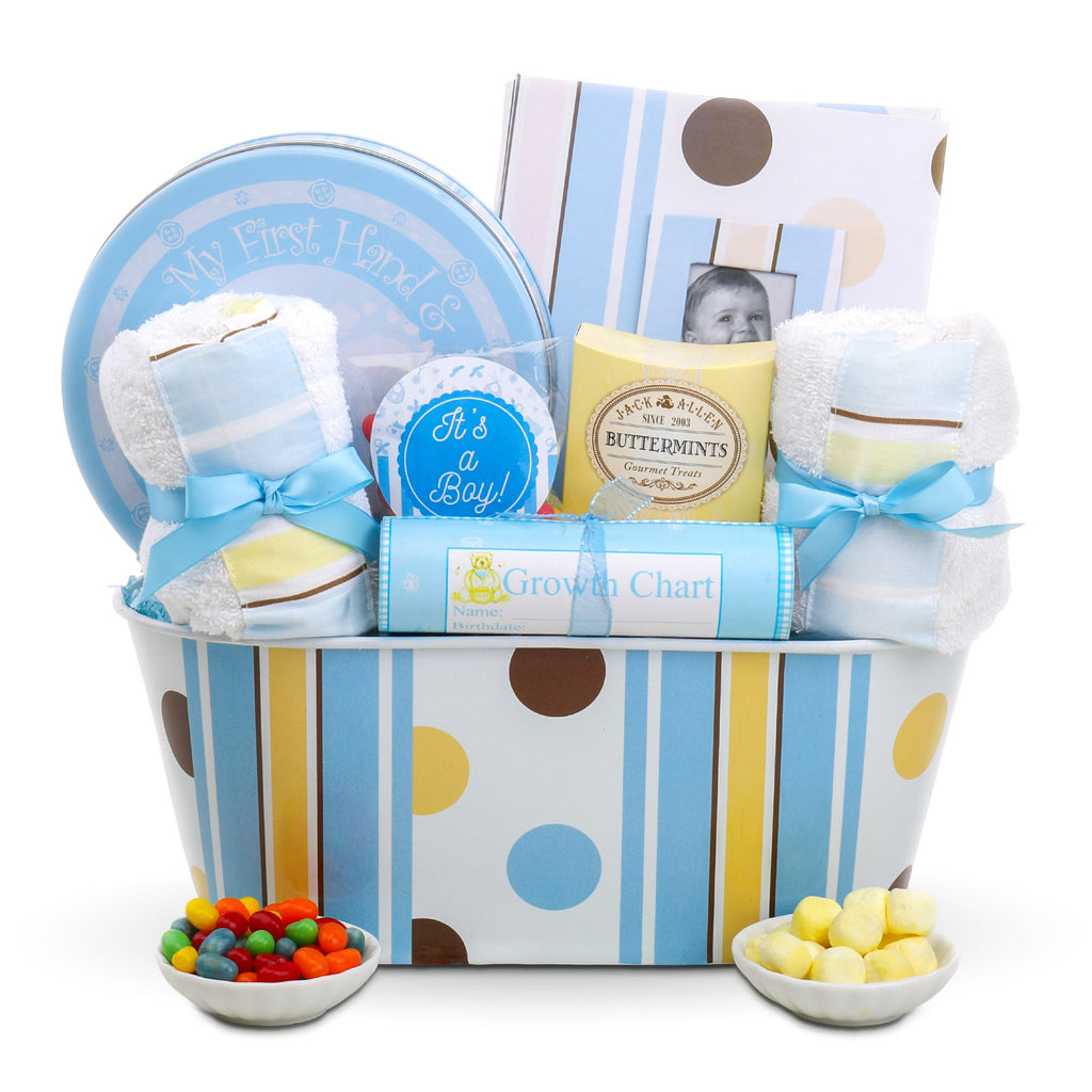 Baby gift basket with toys, snacks, and a growth chart on a white background