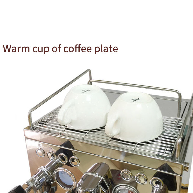 Stainless steel semi-automatic espresso machine with integrated cup warming plate holding two white espresso cups upside down, showcasing the heated cup tray for keeping cups warm before brewing.