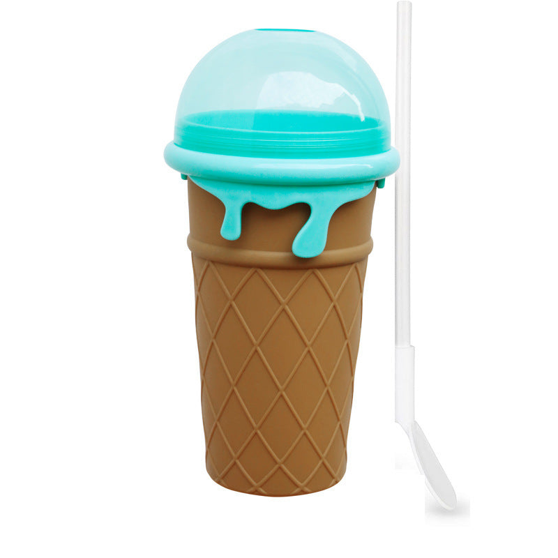 Reusable 500ml ice cream cone-shaped slushy maker cup with a blue BPA-free silicone freezer cup, matching dome lid, built-in straw, and spoon for making homemade frozen smoothies, milkshakes, and slushies.