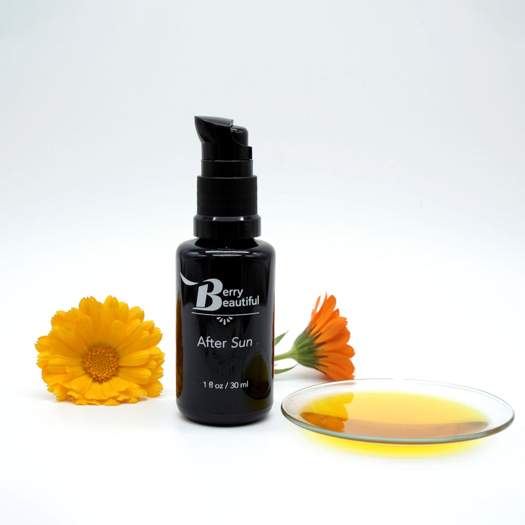 Black bottle labeled 'Bery Beautiful' with 'After Sun' text, surrounded by flowers and a dish of yellow liquid on a white background. A luxurious blend of calendula and vanilla-infused raspberry seed oil, crafted to soothe, hydrate, and rejuvenate skin after sun exposure. Unlike typical calendula infusions made with low-cost oils like sunflower, we use our own cold-pressed raspberry seed oil, elevating the infusion’s effectiveness. Packed with vitamins E, A, and B, as well as potent antioxidants.