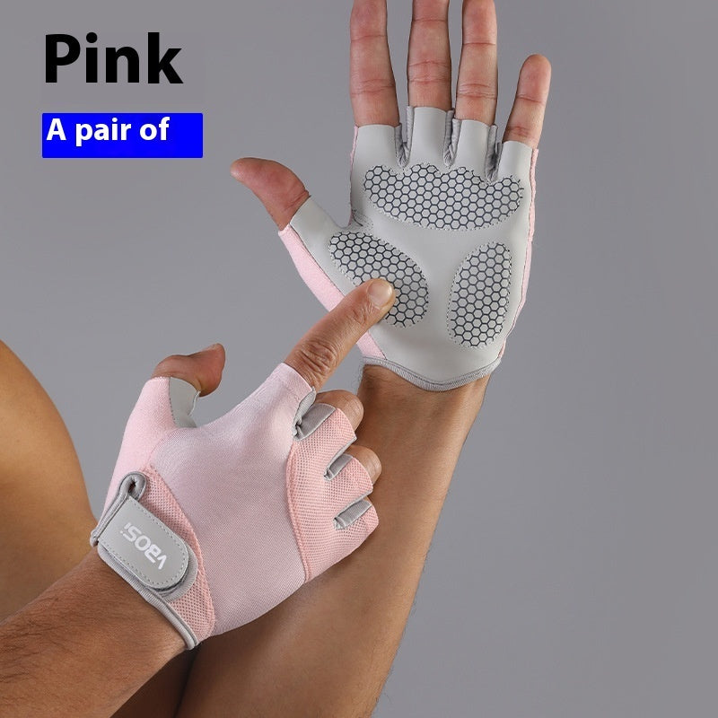 Pink and gray gloves on a person's hand with 'GO' branding, against a gray background.