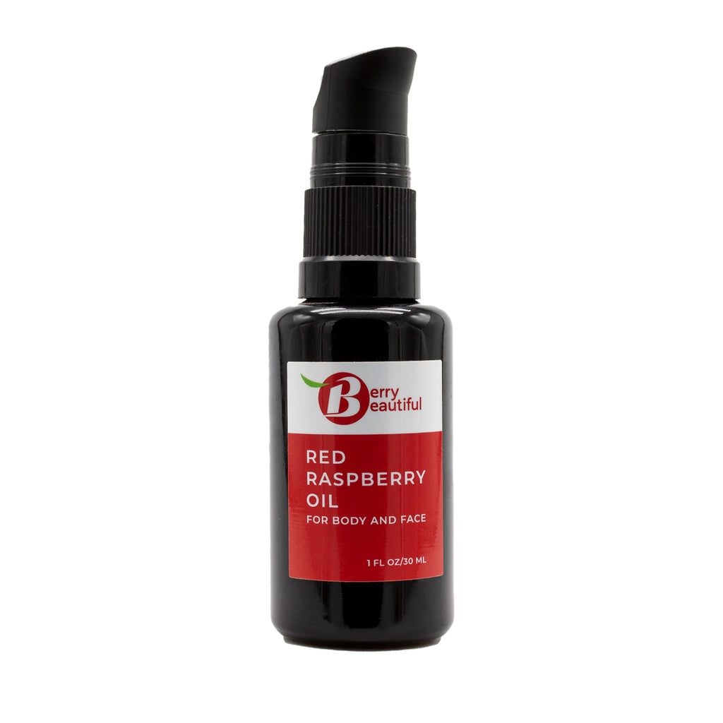 Bottle of Red Raspberry Oil for body and face with a black pump on a white background