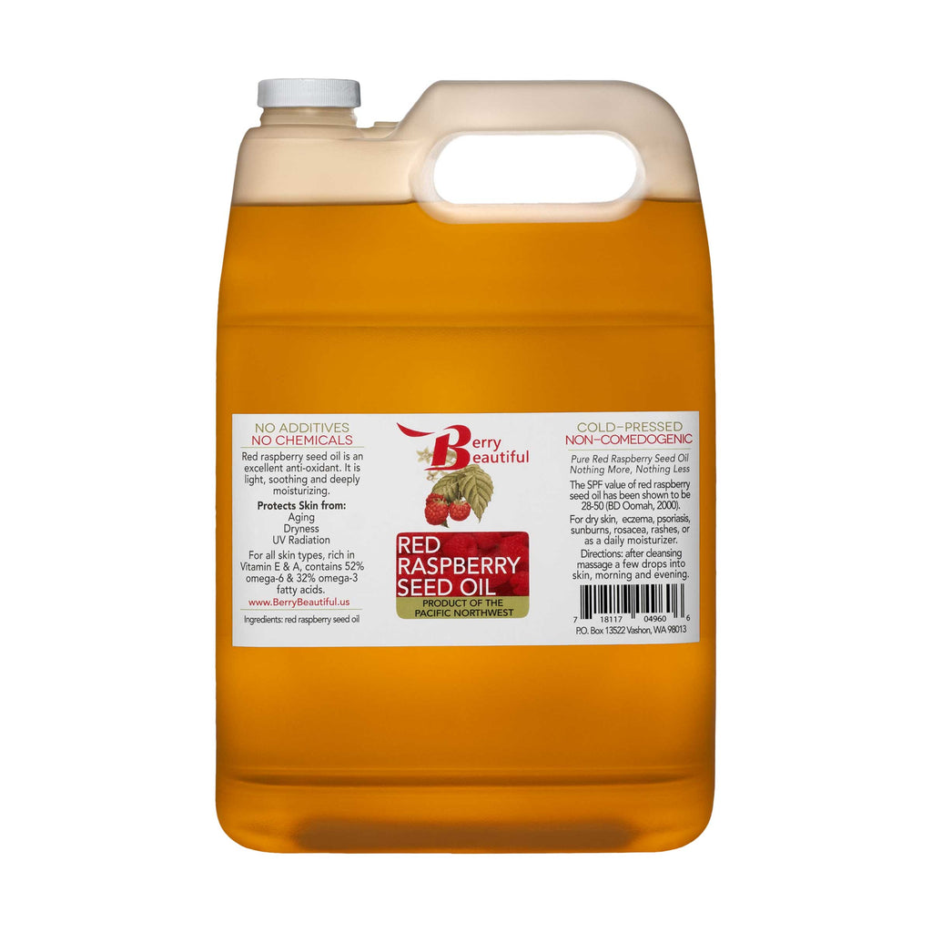Large container of red raspberry seed oil with a visible label on a white background