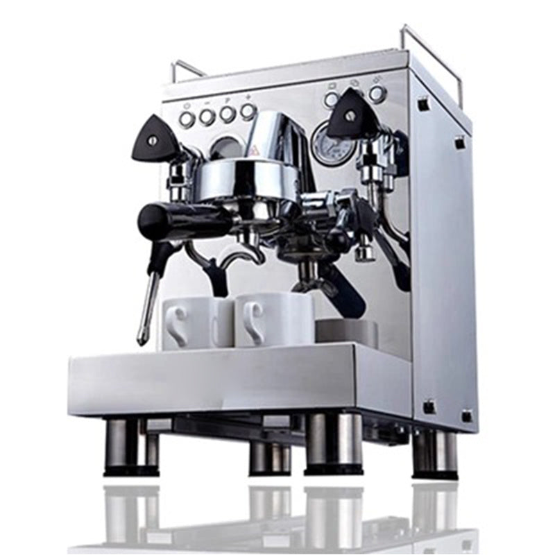 Stainless steel semi-automatic espresso machine with dual steam wands and two white espresso cups on the warming tray, displayed on a white background.