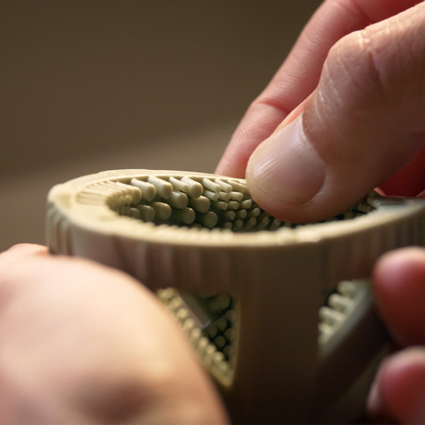 Close-up of the flexible silicone scrubbing nubs inside a GoodEgg egg cleaning brush as a person presses the textured interior, highlighting the soft food-grade bristles designed to gently clean farm-fresh chicken, duck, goose, and backyard poultry eggs without damaging the shell.