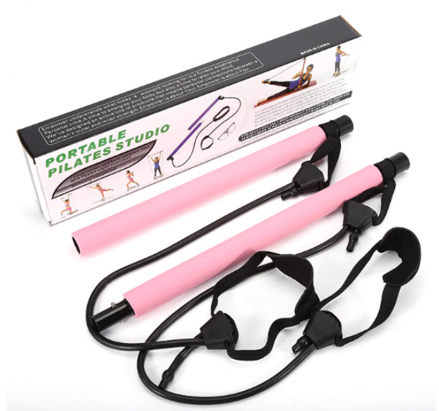 Pink exercise bars with resistance bands and packaging on a white background